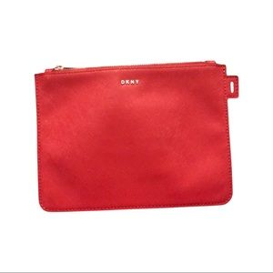 DKNY zip up pouch. Use as a makeup case,a clutch.. Nice Dark red color.